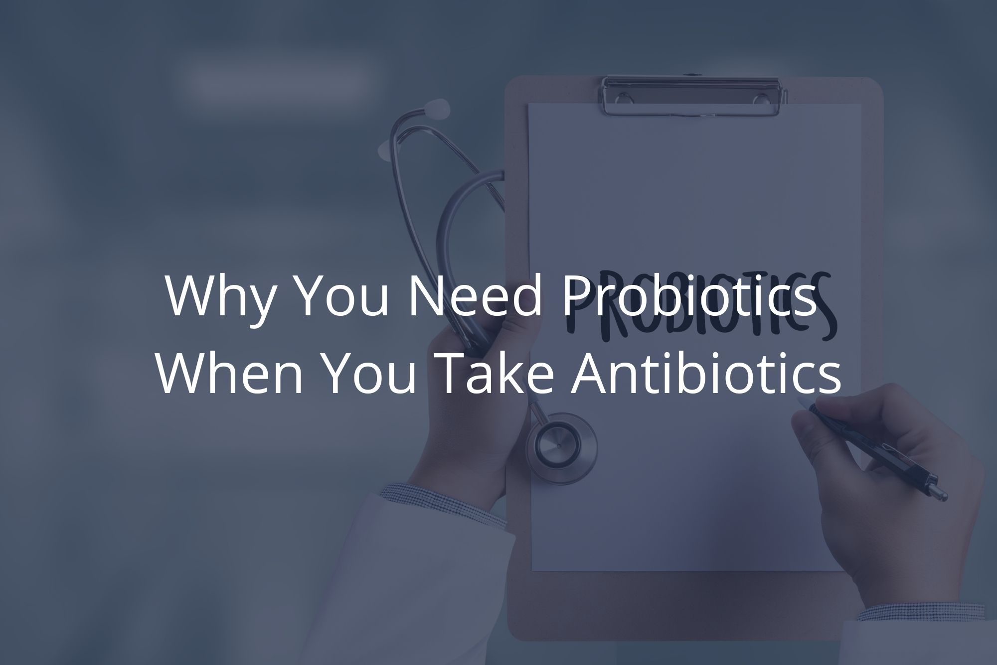 A physician holding a clipboard writes on a piece of paper to tell a patient that they can take probiotics with antibiotics.