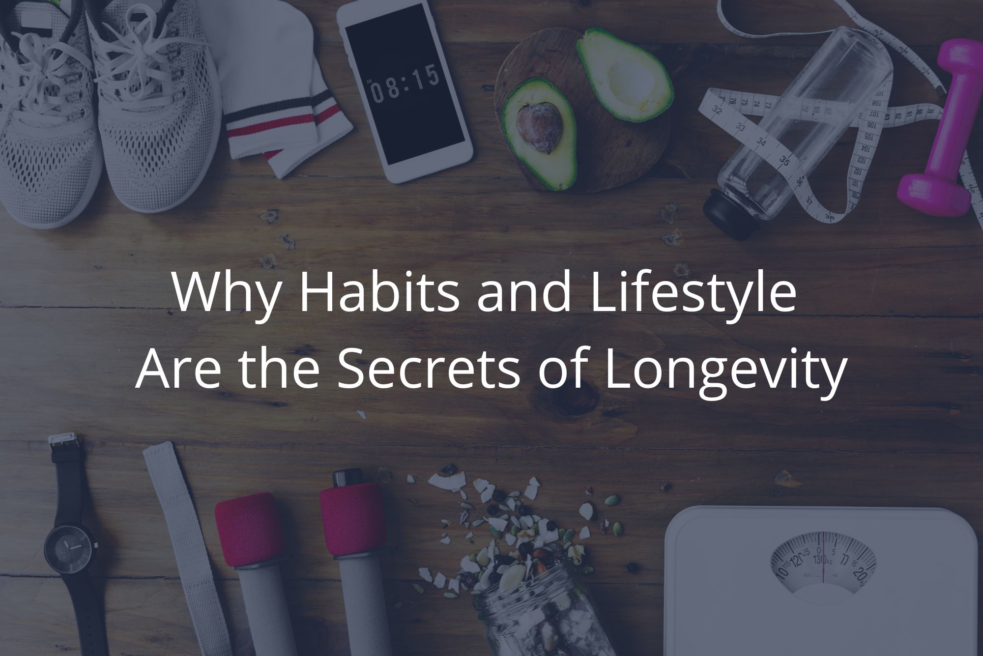 An above shot of tennis shoes, weights, a scale, an avocado, and other implied contributors to longevity. 