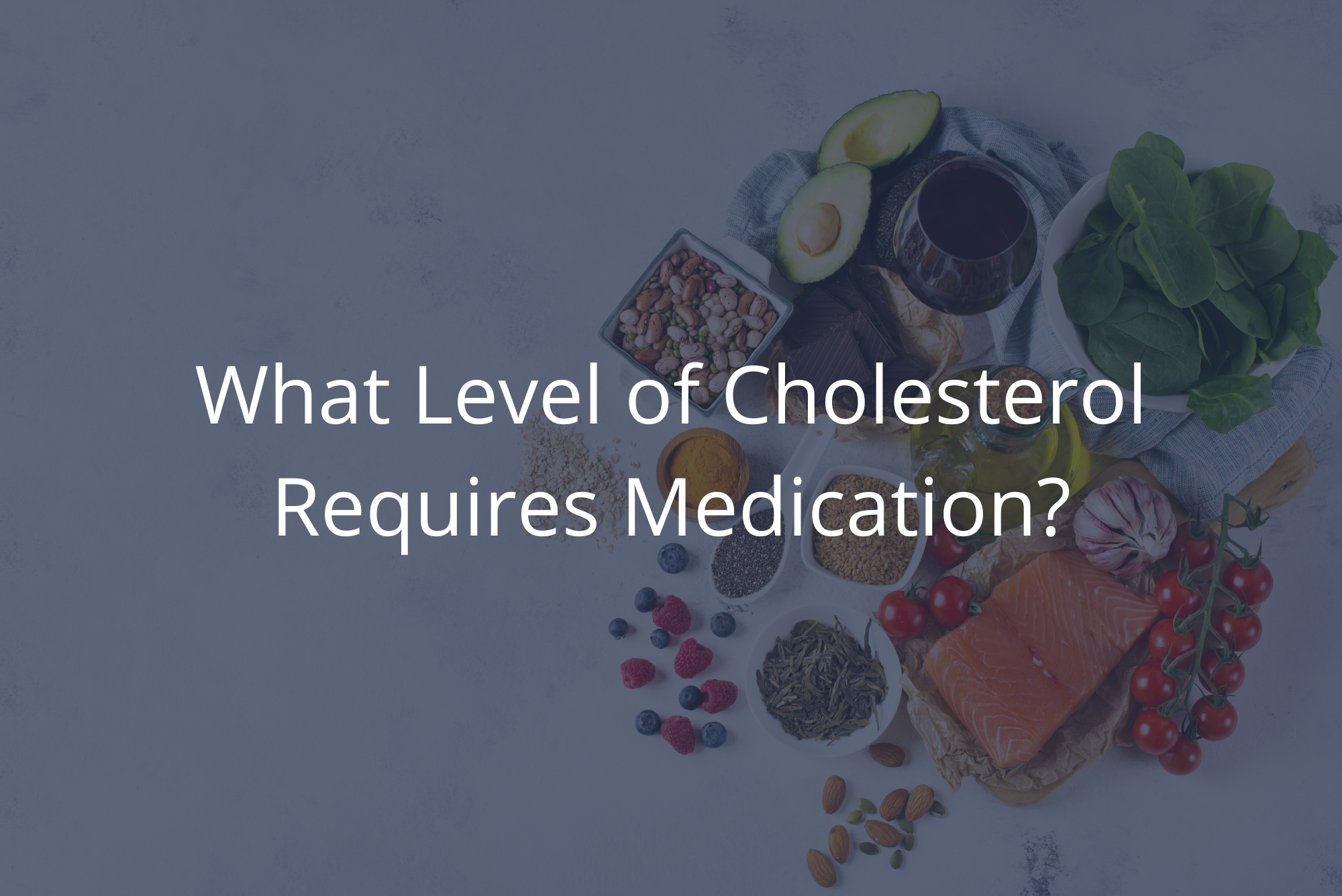 Various healthy foods that are good for people with high cholesterol are piled together on a marble countertop with overlay.