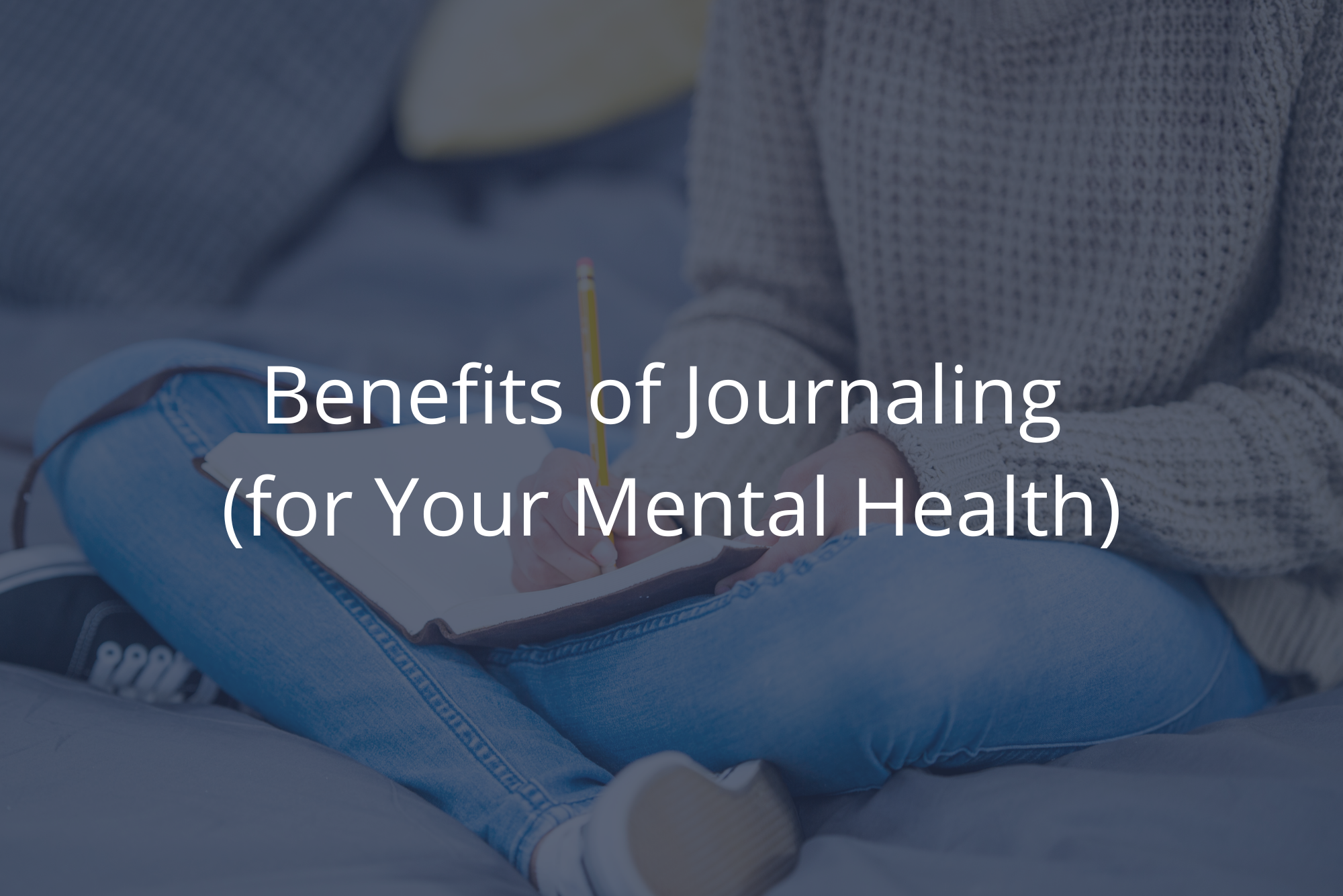 A woman sits indian style, with her journal in her lap, writing in it, after learning how journaling can help mental health with a dark overlay.