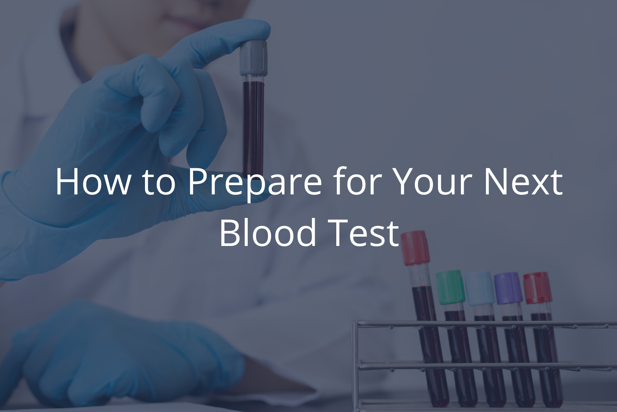 A lab tech holds up a vial of blood from a patient, representing a discussion on how to prepare for a blood test.