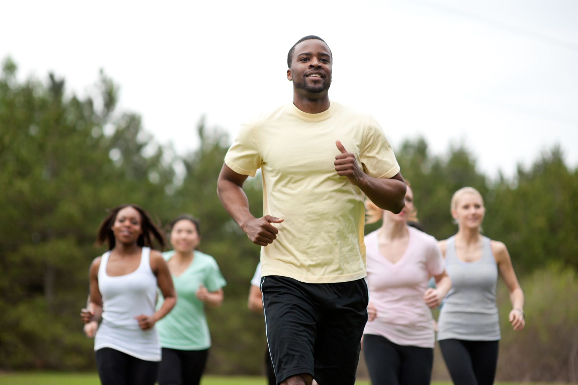 A group of friends try speed walking, an aerobic exercise, after their anaerobic Pilates class.