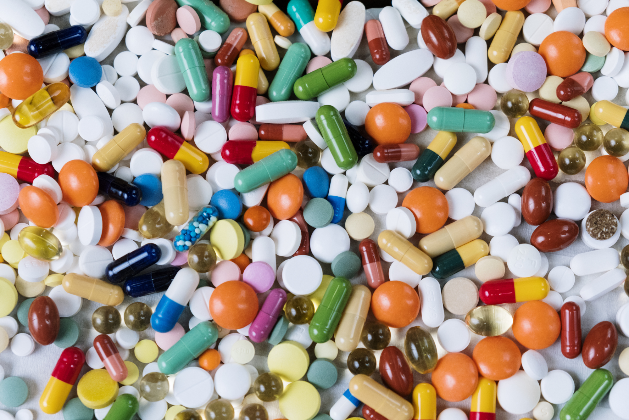 A pile of assorted OTC cold and flu medications.