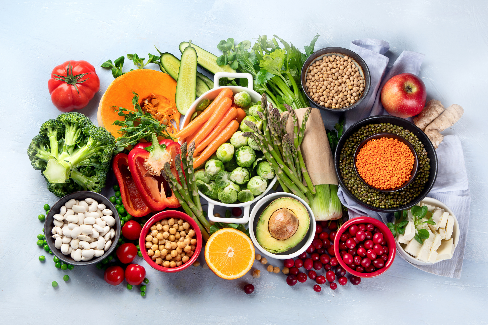 A top-down view of a pile of assorted anti-inflammatory foods on a quartz countertop.